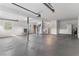 Spacious basement with concrete floors, multiple windows, and a utility sink with a refrigerator at 7470 Lake Marsha Dr, Orlando, FL 32819