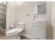 Well-lit half-bathroom with floating vanity and modern toilet in a minimalist design at 7470 Lake Marsha Dr, Orlando, FL 32819