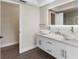 Modern bathroom featuring double bowl sink, quartz countertop, and illuminated mirror at 7470 Lake Marsha Dr, Orlando, FL 32819