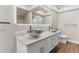 Modern bathroom featuring double vessel sinks, quartz countertop, and illuminated mirror at 7470 Lake Marsha Dr, Orlando, FL 32819