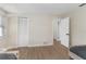 Bedroom with wood floors and ample space featuring closet and adjoining doors offers versatility at 7470 Lake Marsha Dr, Orlando, FL 32819