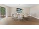 Bright dining room featuring a modern table with seating for eight and a large glass sliding door at 7470 Lake Marsha Dr, Orlando, FL 32819
