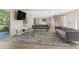 Stylish living room showcasing modern decor, an open floor plan, and seamless connectivity to the kitchen and dining area at 7470 Lake Marsha Dr, Orlando, FL 32819