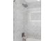 Stylish shower featuring textured white tiles, sleek fixtures, and recessed niche offers a spa-like experience at 7470 Lake Marsha Dr, Orlando, FL 32819