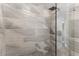 Modern shower with stylish tile walls, sleek fixtures, and glass enclosure at 7470 Lake Marsha Dr, Orlando, FL 32819