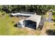 Aerial view of a expansive property featuring a house, carport and ample yard space at 8218 Pine Island Rd, Clermont, FL 34711