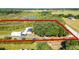 Aerial view showcasing the house and land at 8218 Pine Island Rd, Clermont, FL 34711