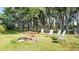 Enjoy outdoor relaxation on this expansive backyard with mature trees at 8218 Pine Island Rd, Clermont, FL 34711