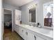 The bathroom features a long vanity with a sink and access to an additional room at 8218 Pine Island Rd, Clermont, FL 34711