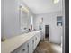 The bathroom features a long vanity with storage and a decorative window at 8218 Pine Island Rd, Clermont, FL 34711