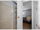 This bathroom leads to the bedroom with a shower and storage space at 8218 Pine Island Rd, Clermont, FL 34711