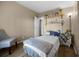 Relaxing bedroom with wood-look floors, neutral colors, and decorative shelving at 8218 Pine Island Rd, Clermont, FL 34711