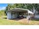 This carport provides ample space and protection for vehicles and equipment at 8218 Pine Island Rd, Clermont, FL 34711