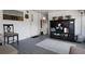 Charming covered patio with gray painted floor and rustic decor accents provides a cozy outdoor living space at 8218 Pine Island Rd, Clermont, FL 34711