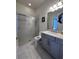 Modern bathroom with tiled shower, sleek vanity, and updated fixtures for a luxurious feel at 8405 Adalina Pl, Orlando, FL 32827