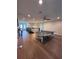 A large bonus room features a ping pong table and plenty of space for recreation at 8405 Adalina Pl, Orlando, FL 32827