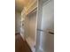 Custom closet with built-in shelving and hanging rods offers ample storage space and organization solutions at 8405 Adalina Pl, Orlando, FL 32827
