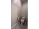 Clean and functional half bathroom features sleek fixtures and neutral tones, ideal for guests at 8405 Adalina Pl, Orlando, FL 32827