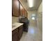 A functional laundry room is equipped with a sink, a washer, and a dryer for convenient chores at 8405 Adalina Pl, Orlando, FL 32827