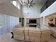 Bright living room boasts soaring ceilings, tile floors, and a ceiling fan for comfortable living at 8405 Adalina Pl, Orlando, FL 32827