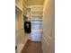 Spacious walk-in closet featuring custom shelving, drawers, and hanging rods for optimal storage at 8405 Adalina Pl, Orlando, FL 32827