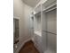 This walk-in closet features custom shelving and drawers, creating an organized storage solution at 8405 Adalina Pl, Orlando, FL 32827