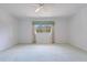 Spacious bedroom featuring a ceiling fan and a large window at 8830 Sw 98Th Pl # M, Ocala, FL 34481