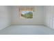 Bright bedroom with large window and closet space offers a serene retreat at 8830 Sw 98Th Pl # M, Ocala, FL 34481