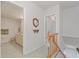 Hallway view leading to a bathroom and stairs at 8830 Sw 98Th Pl # M, Ocala, FL 34481