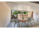 Enclosed patio featuring tile flooring, outdoor seating, and bright natural light at 8830 Sw 98Th Pl # M, Ocala, FL 34481