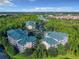The condo community has many buildings surrounded by lush greenery and parking areas, with many neighborhood amenities at 9061 Treasure Trove Ln # 403, Kissimmee, FL 34747