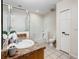 Bathroom with a vanity and sink, tub, toilet, and walk-in shower at 9061 Treasure Trove Ln # 403, Kissimmee, FL 34747