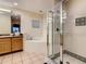 Bathroom featuring a soaking tub, separate shower, and double vanity, providing a spa-like retreat at 9061 Treasure Trove Ln # 403, Kissimmee, FL 34747