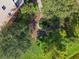 Aerial view of the central courtyard featuring tropical landscaping, seating, and walking paths in a verdant setting at 9061 Treasure Trove Ln # 403, Kissimmee, FL 34747