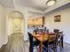 Charming dining area with archways to the kitchen and entryway, perfect for easy entertaining and gatherings at 9061 Treasure Trove Ln # 403, Kissimmee, FL 34747