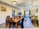 Open living and dining area with ample space and natural light, creating a welcoming atmosphere for relaxation at 9061 Treasure Trove Ln # 403, Kissimmee, FL 34747