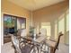 Comfortable outdoor patio with seating area and sliding glass door entry at 9061 Treasure Trove Ln # 403, Kissimmee, FL 34747
