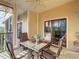 Well-appointed outdoor patio with seating and ceiling fan offers a relaxing space at 9061 Treasure Trove Ln # 403, Kissimmee, FL 34747