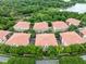 Aerial view of community showcasing residences surrounded by lush green landscapes, highlighting a serene living environment at 918 Lotus Vista Dr # 102, Altamonte Springs, FL 32714