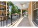 Large covered balcony features tile flooring, offering an excellent outdoor space with beautiful community views at 918 Lotus Vista Dr # 102, Altamonte Springs, FL 32714