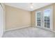 Bright bedroom with a ceiling fan, a carpet and French doors to balcony at 918 Lotus Vista Dr # 102, Altamonte Springs, FL 32714