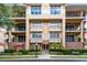 Elegant condo building featuring balconies and manicured landscaping at 918 Lotus Vista Dr # 102, Altamonte Springs, FL 32714