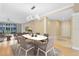 This dining area features a modern light fixture, neutral color palette, and an entryway into a spacious living area at 918 Lotus Vista Dr # 102, Altamonte Springs, FL 32714