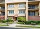 Elegant building facade with manicured landscaping provides an inviting and visually appealing street view at 918 Lotus Vista Dr # 102, Altamonte Springs, FL 32714