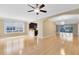 Open-concept living room with hardwood floors, recessed lighting, and access to a private balcony at 918 Lotus Vista Dr # 102, Altamonte Springs, FL 32714