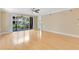 Living room with hardwood floors and sliding glass doors opening to the balcony, offering great views at 918 Lotus Vista Dr # 102, Altamonte Springs, FL 32714