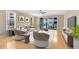 Bright living room with hardwood floors, balcony access, and comfortable seating for relaxation and entertaining at 918 Lotus Vista Dr # 102, Altamonte Springs, FL 32714