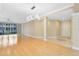 Inviting living area with hardwood floors, modern lighting, and sliding glass doors to the balcony at 918 Lotus Vista Dr # 102, Altamonte Springs, FL 32714