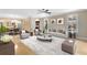Comfortable and inviting living room featuring an open floor plan, hardwood floors, and natural light at 918 Lotus Vista Dr # 102, Altamonte Springs, FL 32714