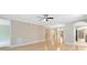 Bright, open living area with hardwood floors and a ceiling fan offers a welcoming space for relaxation and entertainment at 918 Lotus Vista Dr # 102, Altamonte Springs, FL 32714